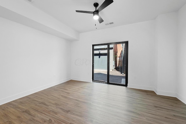 empty room featuring ceiling fan and wood-type flooring