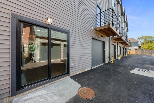 view of exterior entry with a garage