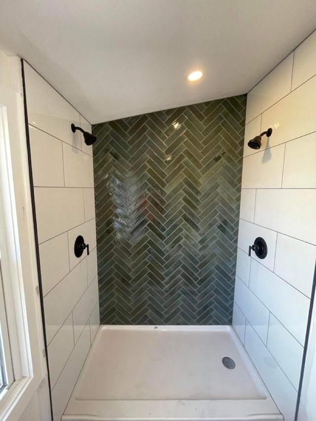 bathroom with a tile shower