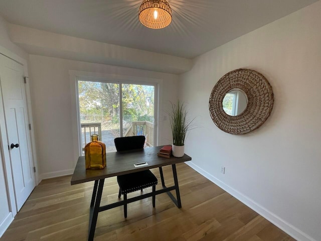 office area with hardwood / wood-style floors