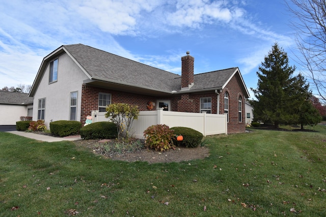 view of home's exterior with a yard