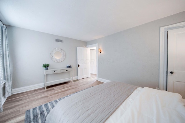 bedroom featuring light wood-type flooring