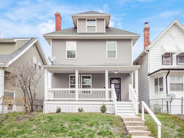 view of front facade with a porch and a front yard