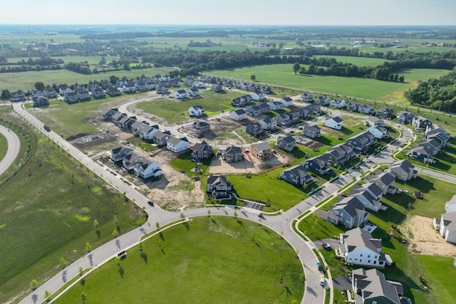 birds eye view of property with a residential view