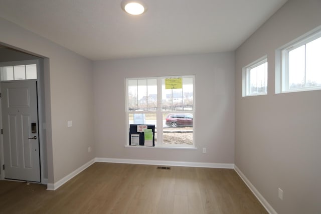 unfurnished room featuring light hardwood / wood-style floors