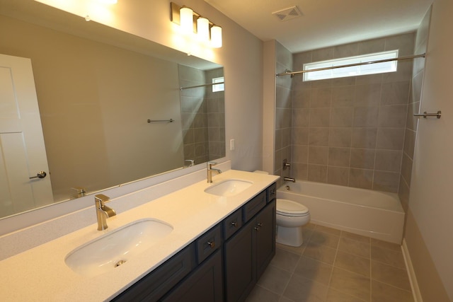 full bathroom with tile patterned flooring, visible vents, toilet, and a sink