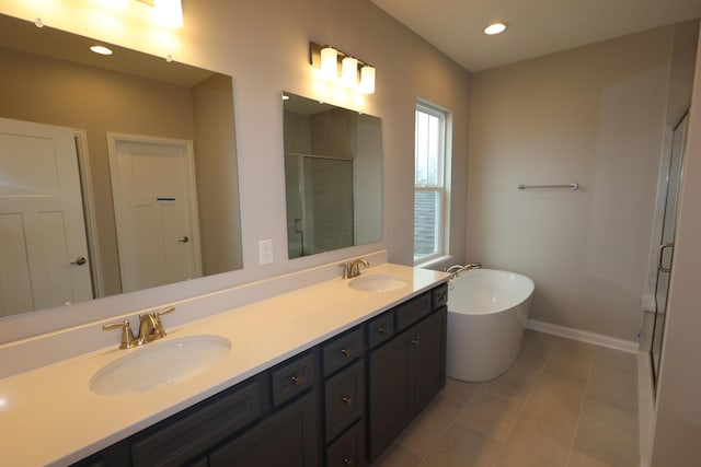 full bathroom with a sink, a soaking tub, double vanity, and a shower stall