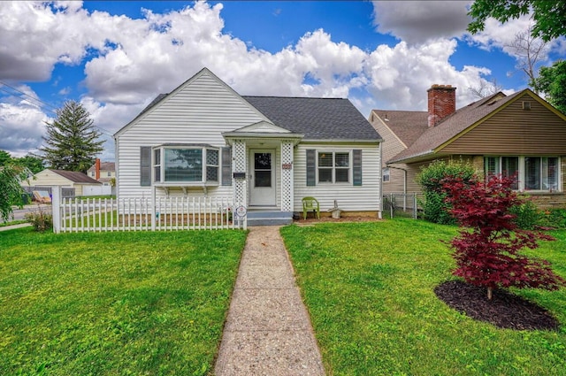 bungalow-style home featuring a front lawn