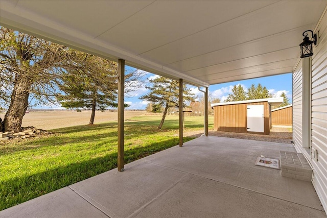 view of patio featuring a shed