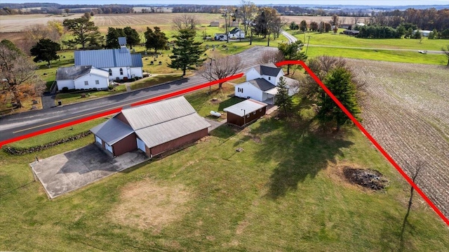 birds eye view of property featuring a rural view