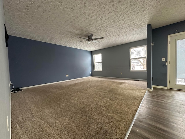 spare room featuring ceiling fan and a textured ceiling