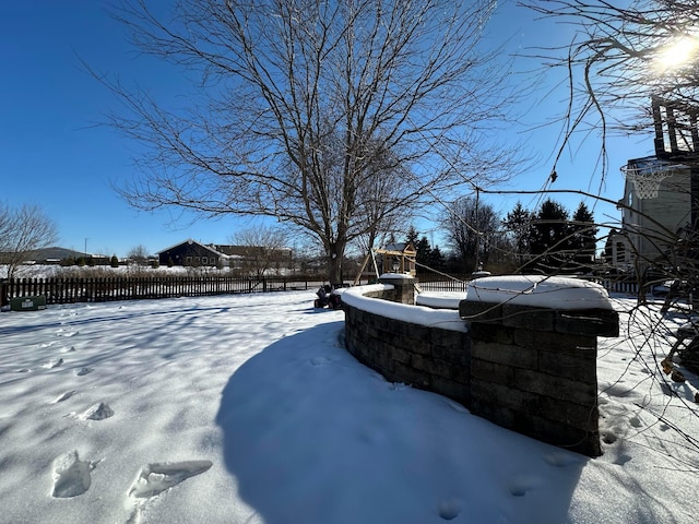 view of yard covered in snow