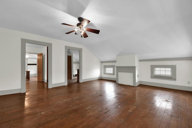 bonus room featuring a wealth of natural light, dark hardwood / wood-style flooring, vaulted ceiling, and ceiling fan