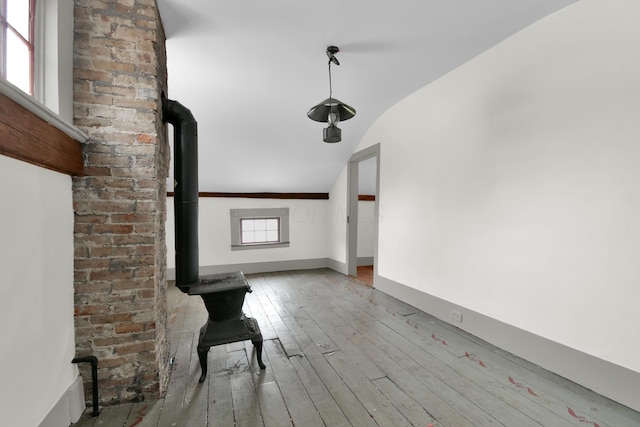 interior space with vaulted ceiling and light wood-type flooring