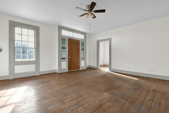 foyer entrance featuring ceiling fan and wood-type flooring