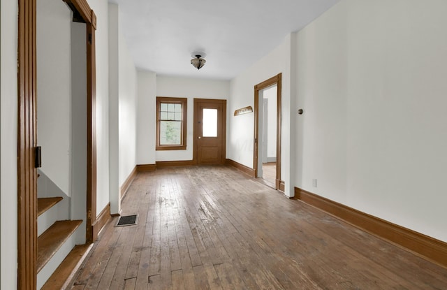 entryway with hardwood / wood-style flooring