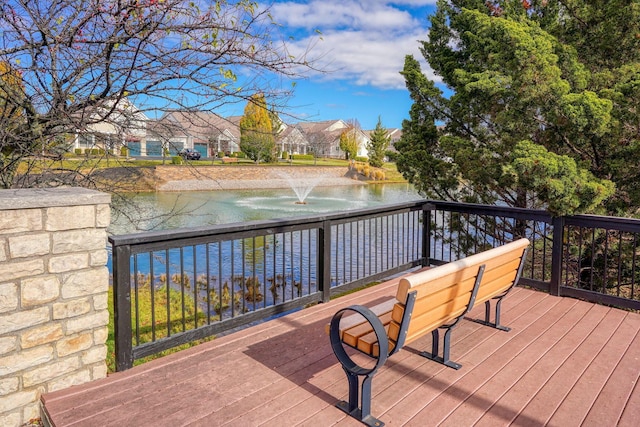 wooden deck with a water view