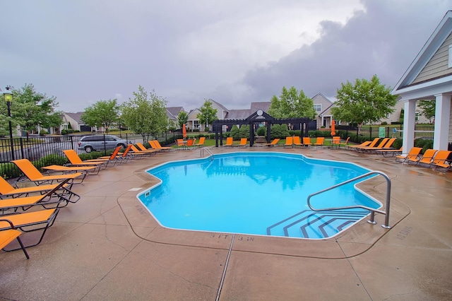 view of swimming pool featuring a patio area