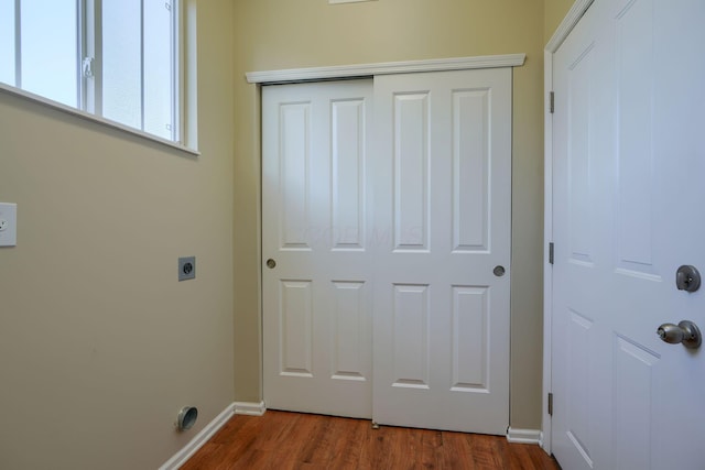 laundry room with hookup for an electric dryer and hardwood / wood-style floors