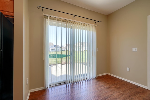 unfurnished room featuring hardwood / wood-style floors