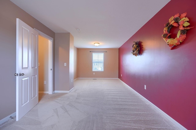 empty room with light colored carpet