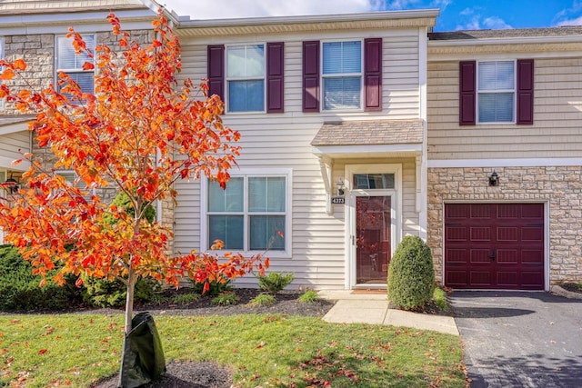 multi unit property featuring a garage