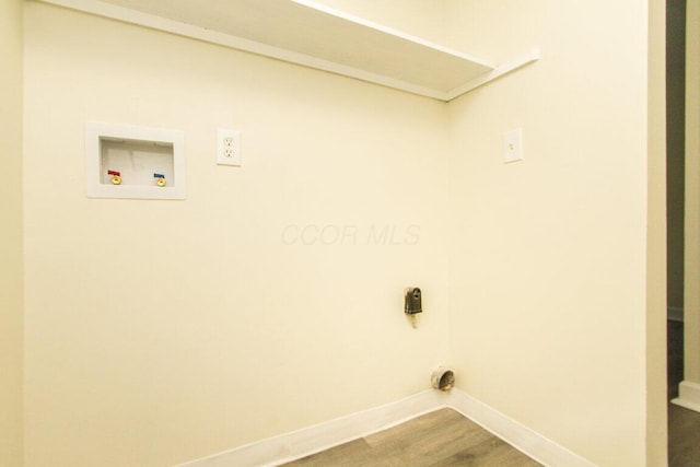 clothes washing area with hardwood / wood-style floors, hookup for an electric dryer, and hookup for a washing machine