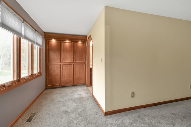 hallway with light carpet