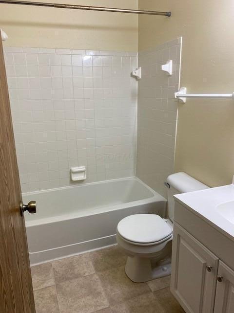 full bathroom featuring vanity, toilet, and tiled shower / bath