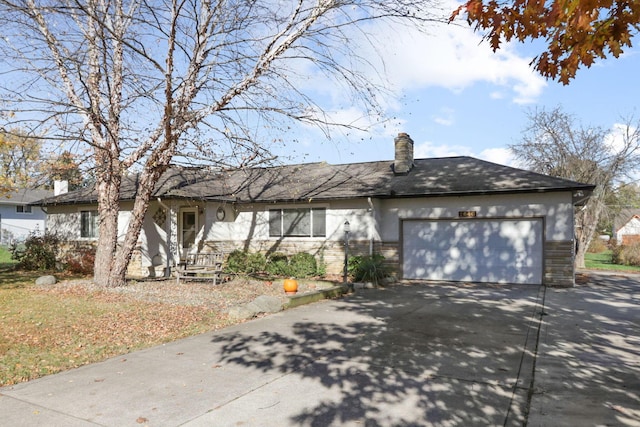 ranch-style home with a garage