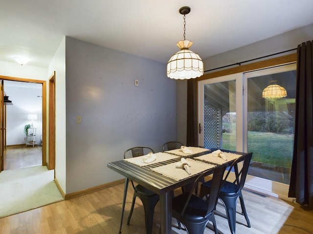 dining room with light wood-type flooring