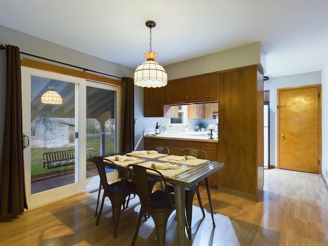 dining space featuring light hardwood / wood-style flooring