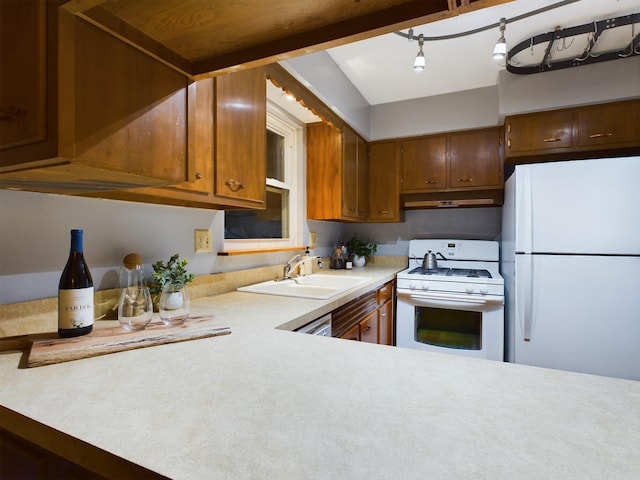 kitchen with sink and white appliances