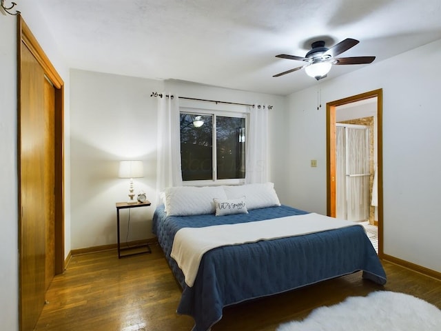 bedroom featuring dark wood-type flooring, ceiling fan, and a closet