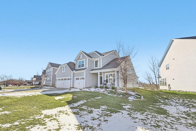 view of front facade with a garage and a front yard