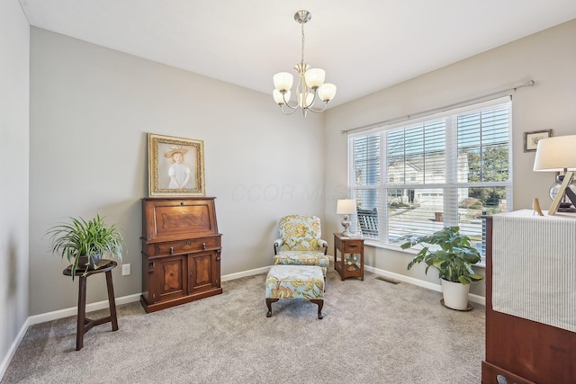 living area with an inviting chandelier and light carpet