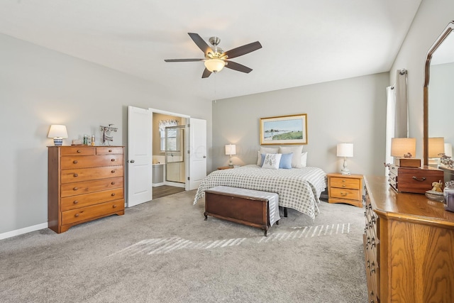 carpeted bedroom with ceiling fan and ensuite bathroom