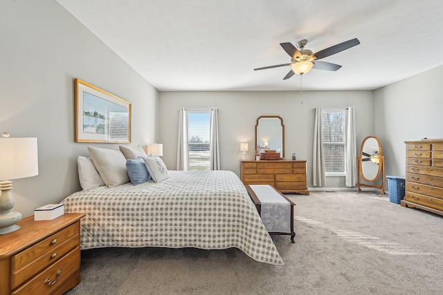 bedroom featuring ceiling fan and carpet