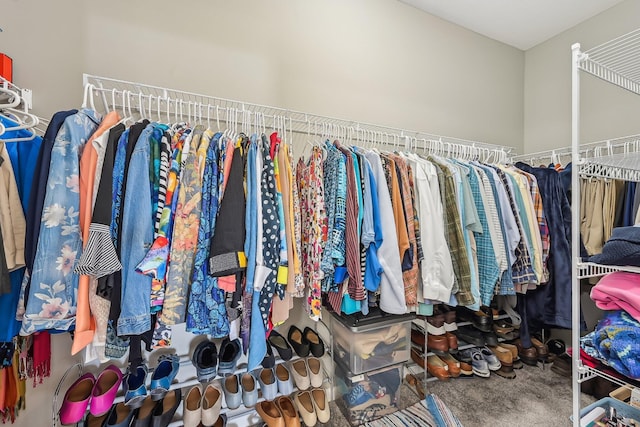 walk in closet featuring carpet