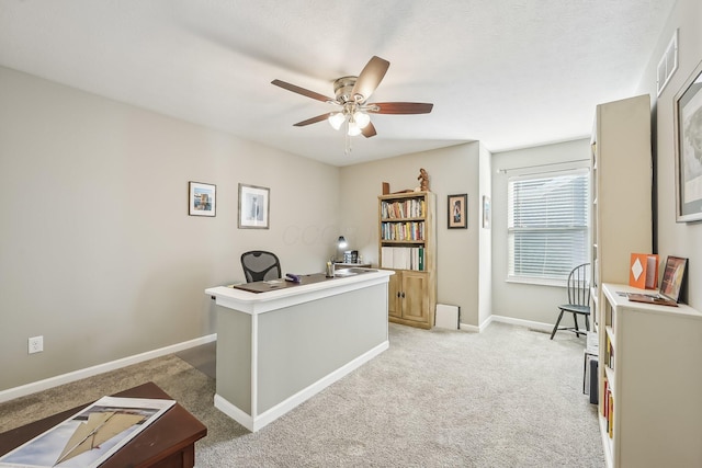 office featuring ceiling fan and light carpet