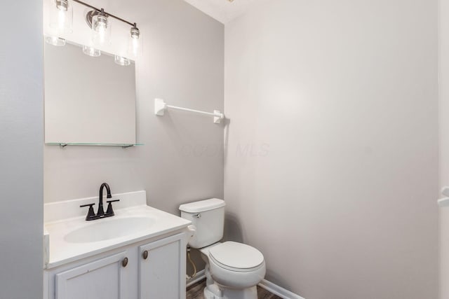 bathroom with vanity, a textured ceiling, and toilet