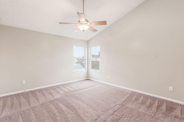 carpeted empty room with ceiling fan, a textured ceiling, and vaulted ceiling