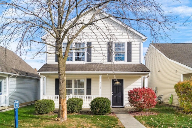 view of front facade with a porch and a front yard