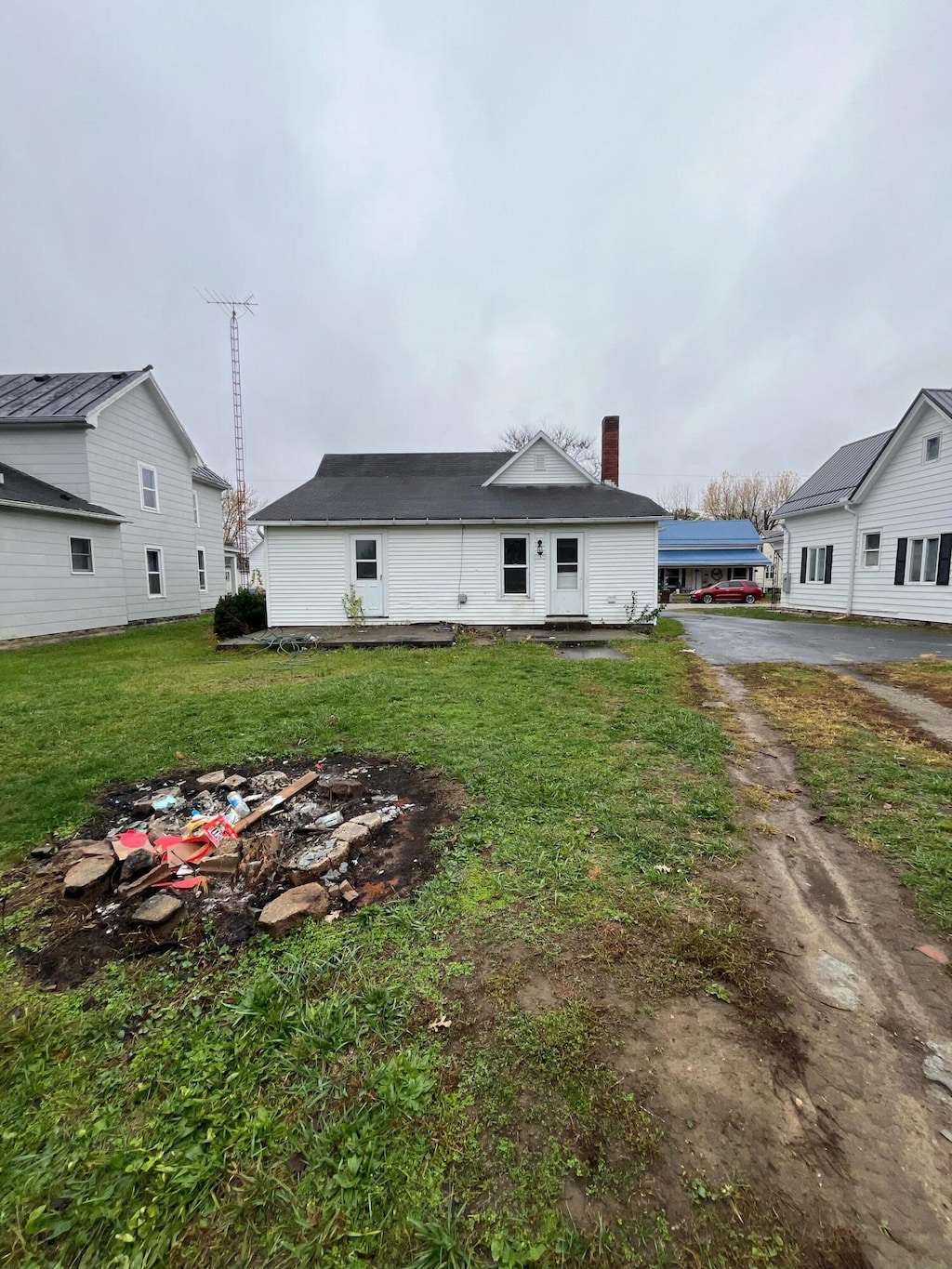 rear view of property featuring a yard