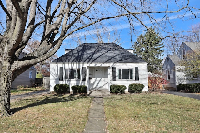 bungalow with a front yard