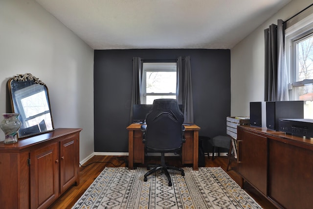 home office with dark wood-type flooring