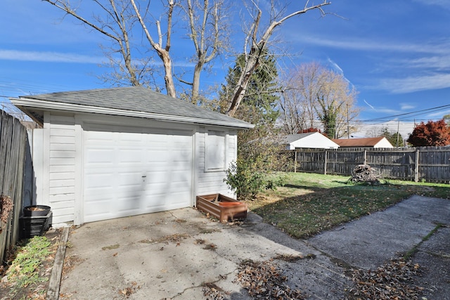 garage with a lawn