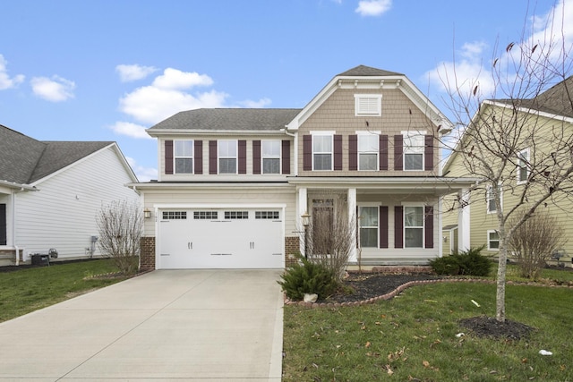 view of front of property featuring a front yard and a garage