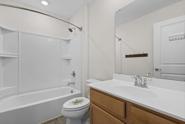 full bathroom featuring hardwood / wood-style flooring, shower / washtub combination, vanity, and toilet