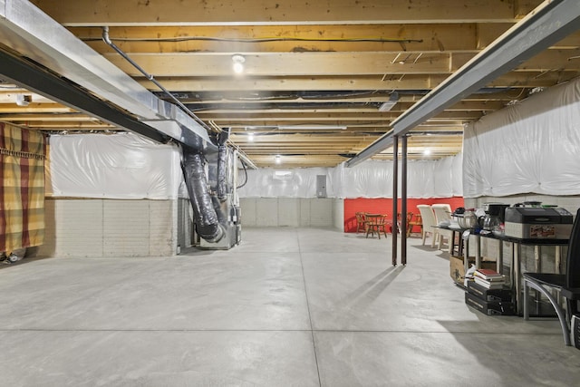 basement with electric panel and heating unit